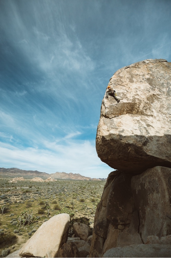 A climber on Headstone Rock in Joshua Tree National Park