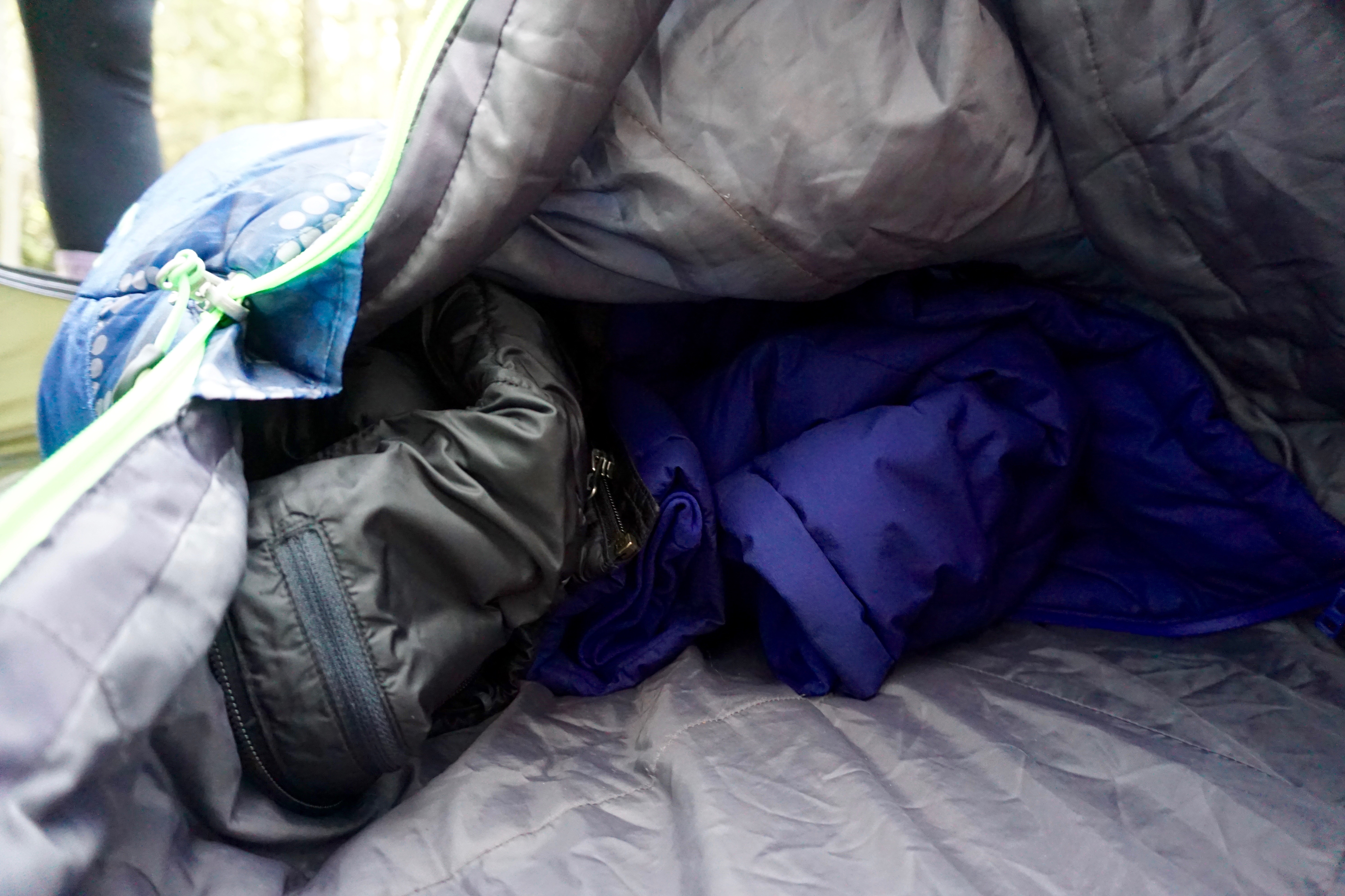 Stuff clothing into the empty space at the bottom of your bag to keep warm