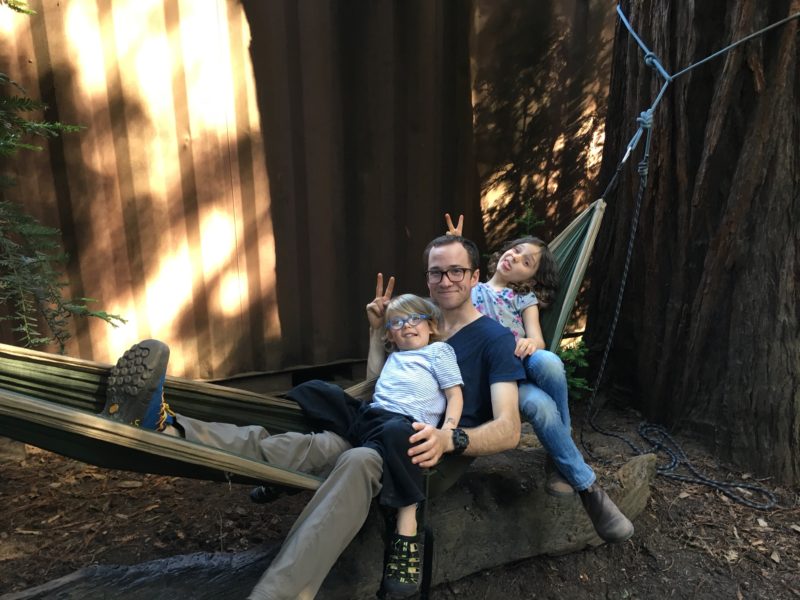 Kid-friendly outdoor adventures include hanging with uncles in a hammock!
