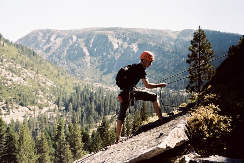 Lovers leap climbing guide - Cole belaying at the top of Pop Bottle